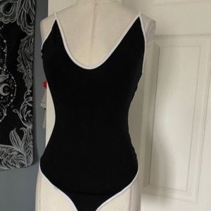 Flattering black bodysuit with white trim